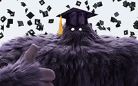 Monster mascot with a gradution hat giving a thumbsup.