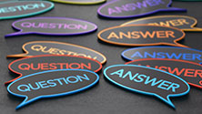 Multicolored cartoon bubbles with the words Question and Answer in them.