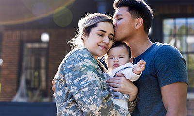 Recruiting and Hiring Military & Veteran Spouses with MonsterGov - military family holding each other