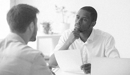 recruitment solutions Man interviewing another man